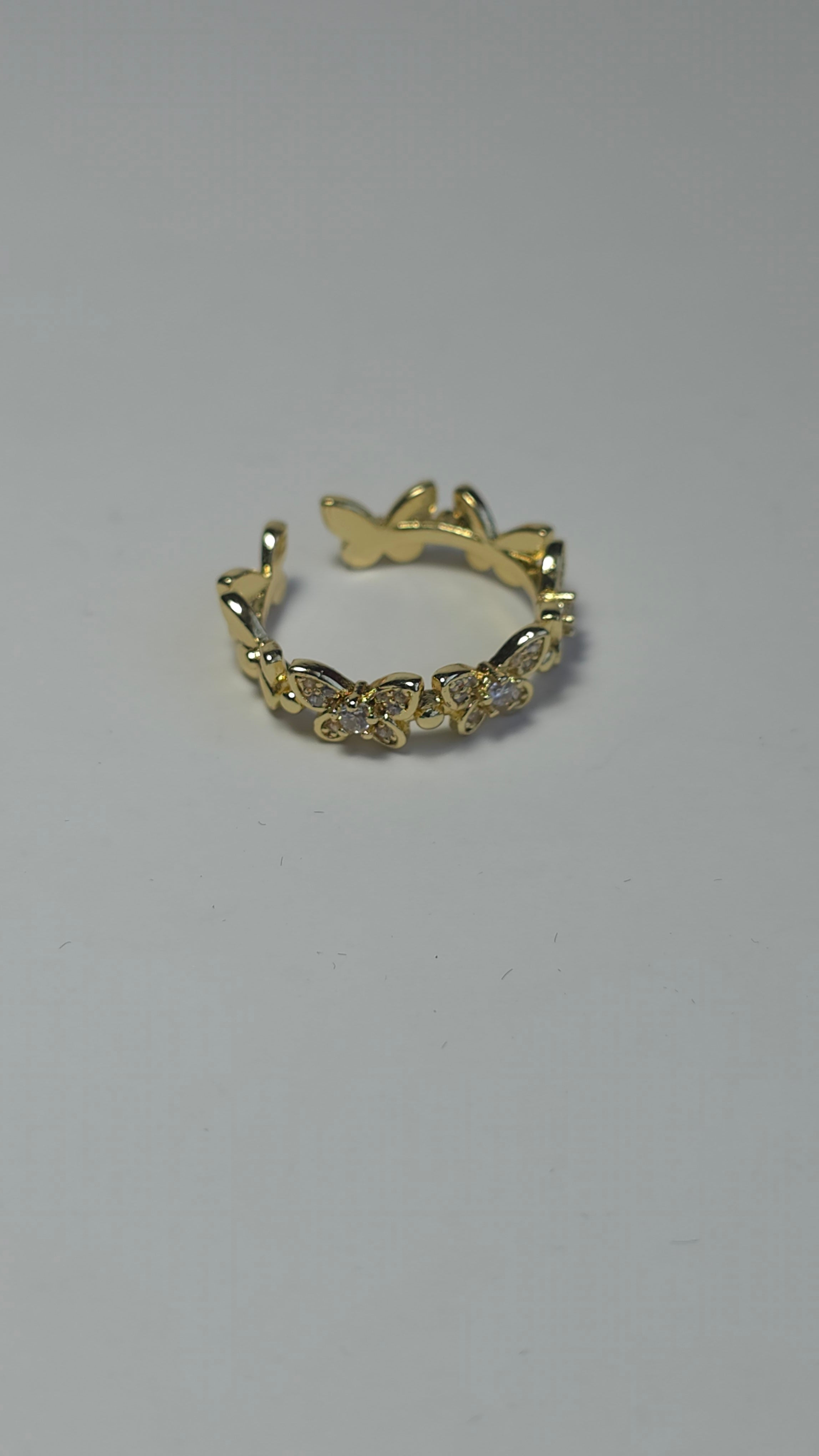 Anillos ajustables y circonita cúbica en forma de mariposa