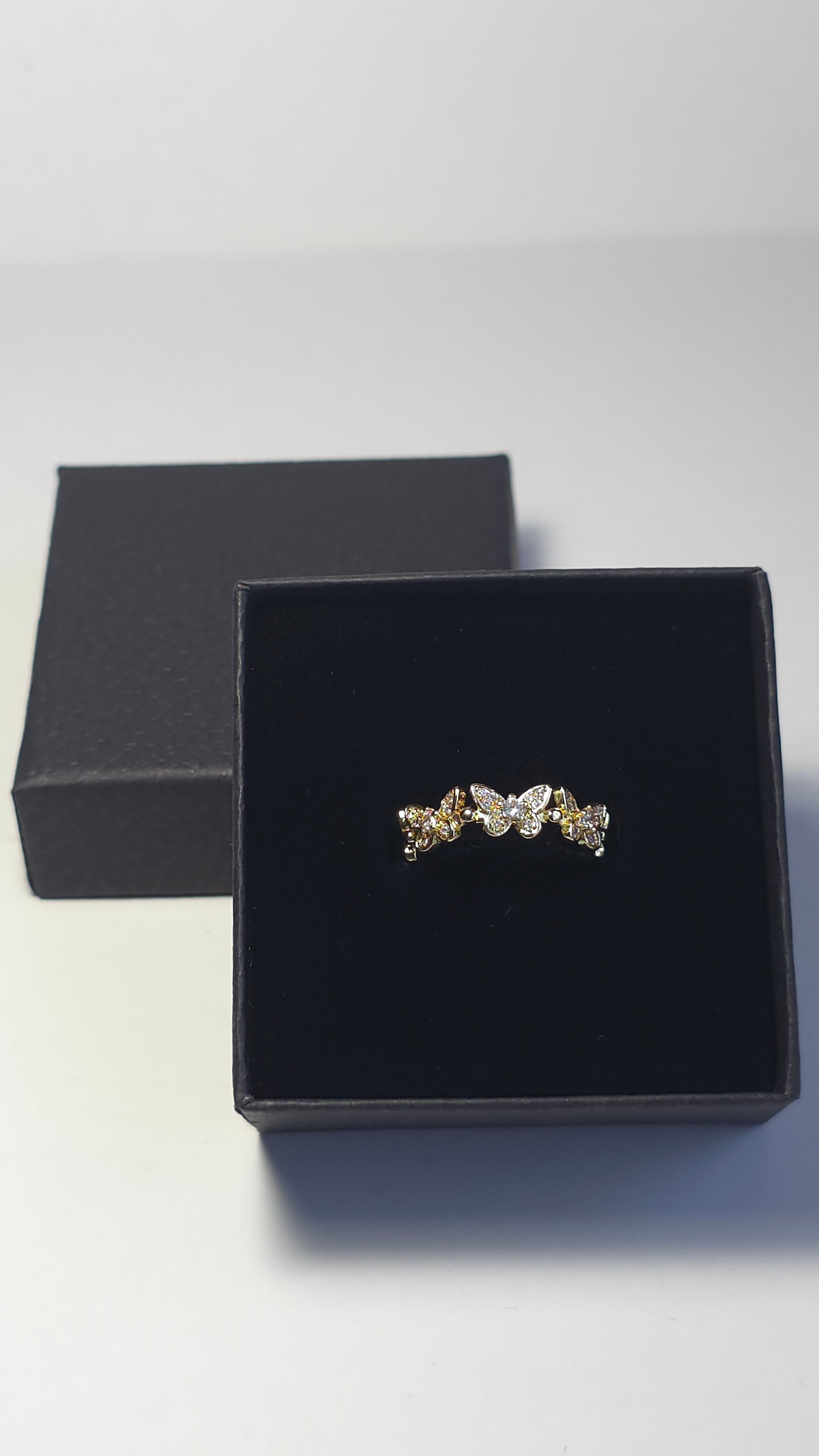 Anillos ajustables y circonita cúbica en forma de mariposa