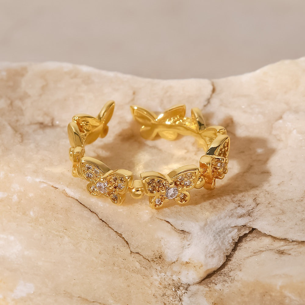 Anillos ajustables y circonita cúbica en forma de mariposa